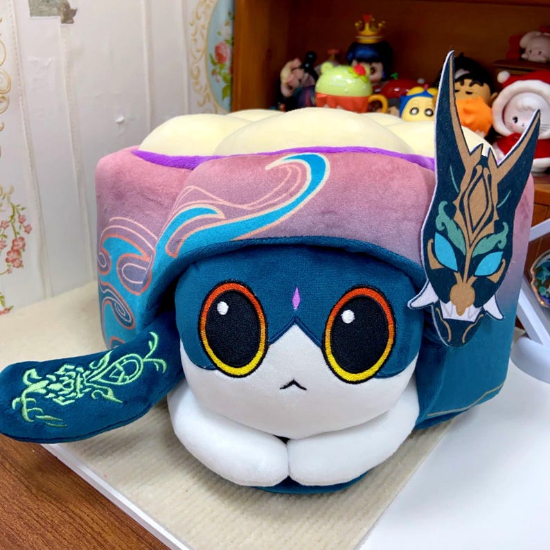 Embrace Xiao's Softer Side: The Genshin Cat Cake Plushie!