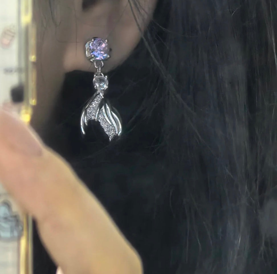 Model wearing the Rafayel fishtail earrings for a subtle daily otome game fan look.