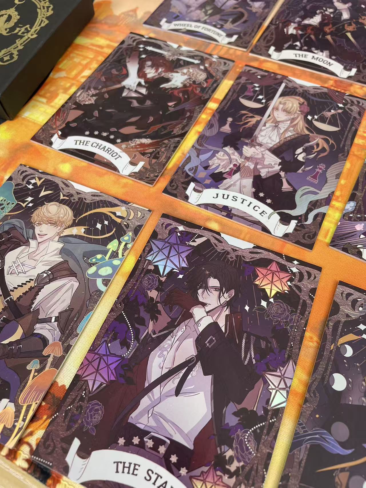 Lord of the Mysteries Paradox Starry Raven tarot card set Chariot Justice and Star card close-up
