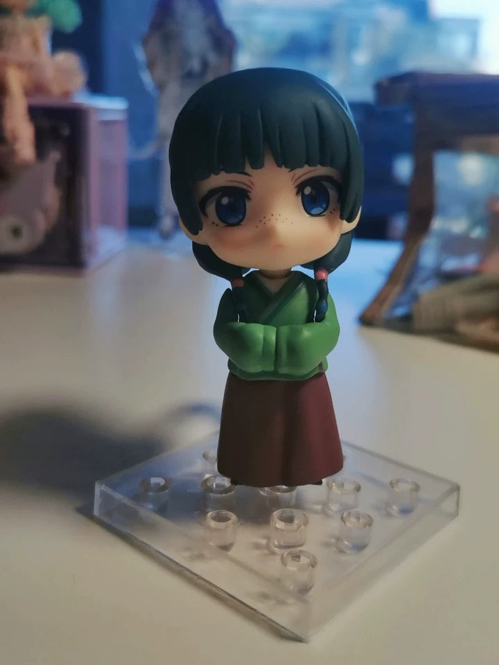 Maomao chibi figure posed on the included clear display stand