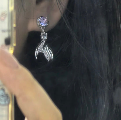 Model wearing the Rafayel fishtail earrings for a subtle daily otome game fan look.