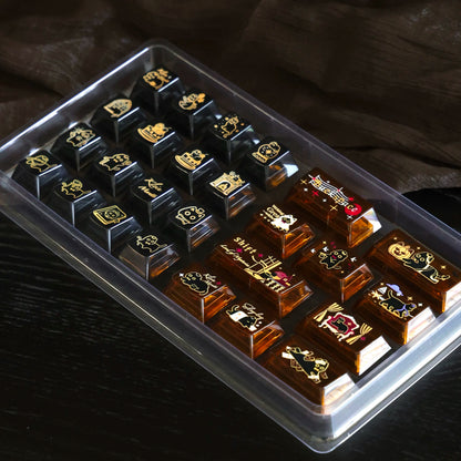 Angled view of dark and amber transparent cat keycaps