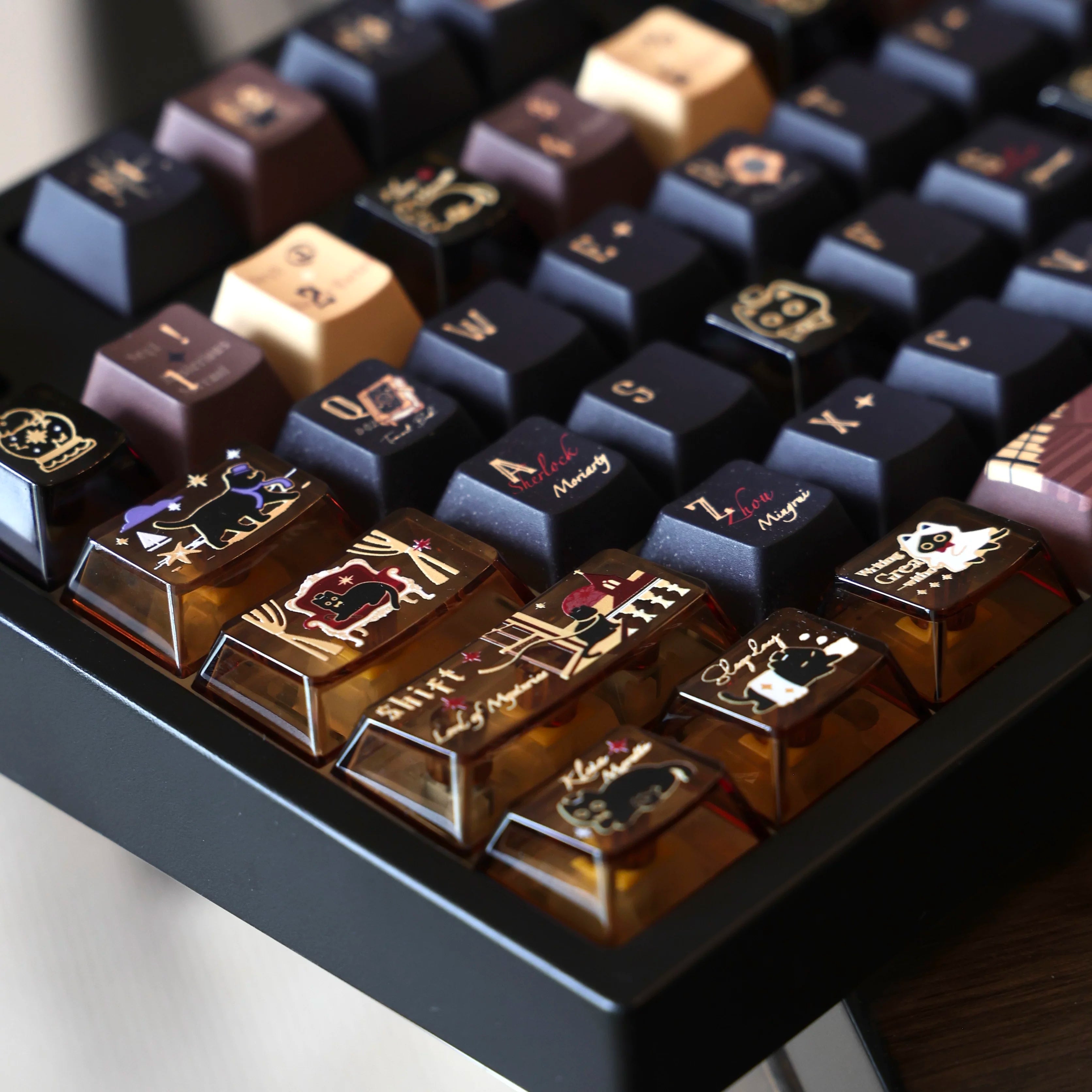 Close-up of transparent cat keycaps with dark and amber accents