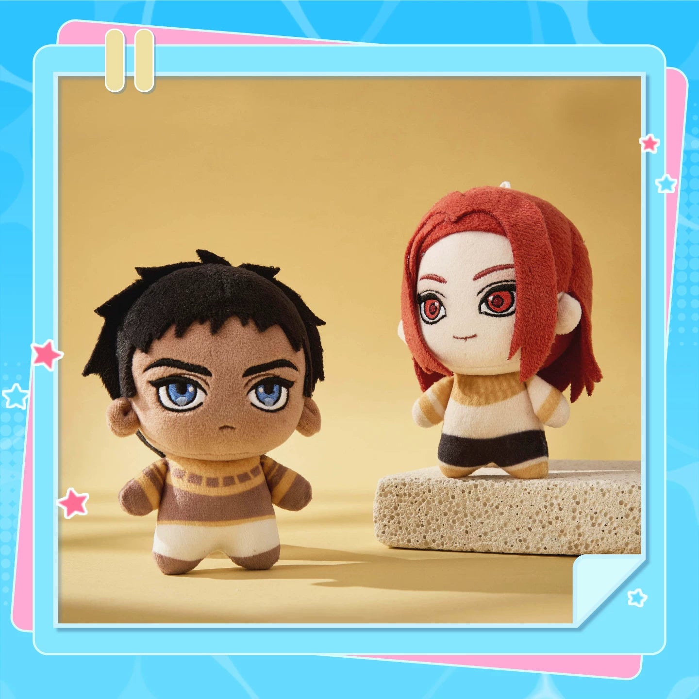ENNEAD Horus and Seth plush charms in a styled display