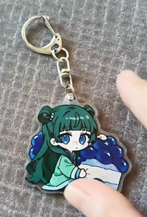 Handheld Maomao blueberry cake acrylic keychain with silver-tone clasp