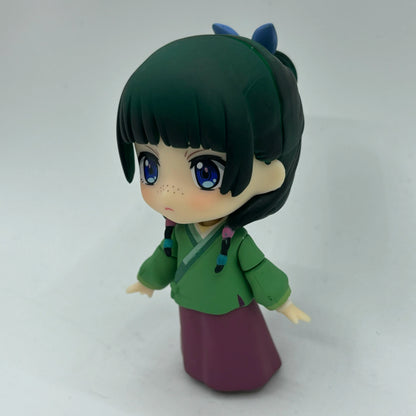 Maomao chibi figure three-quarter view with green top and purple skirt